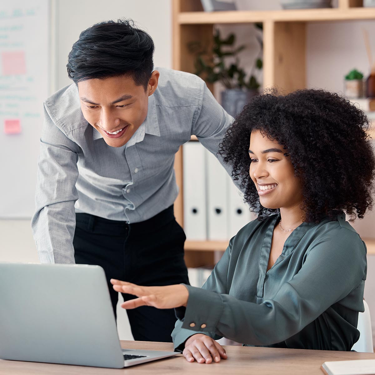 Two home product manufacturers review a Persona Builder report on screen.