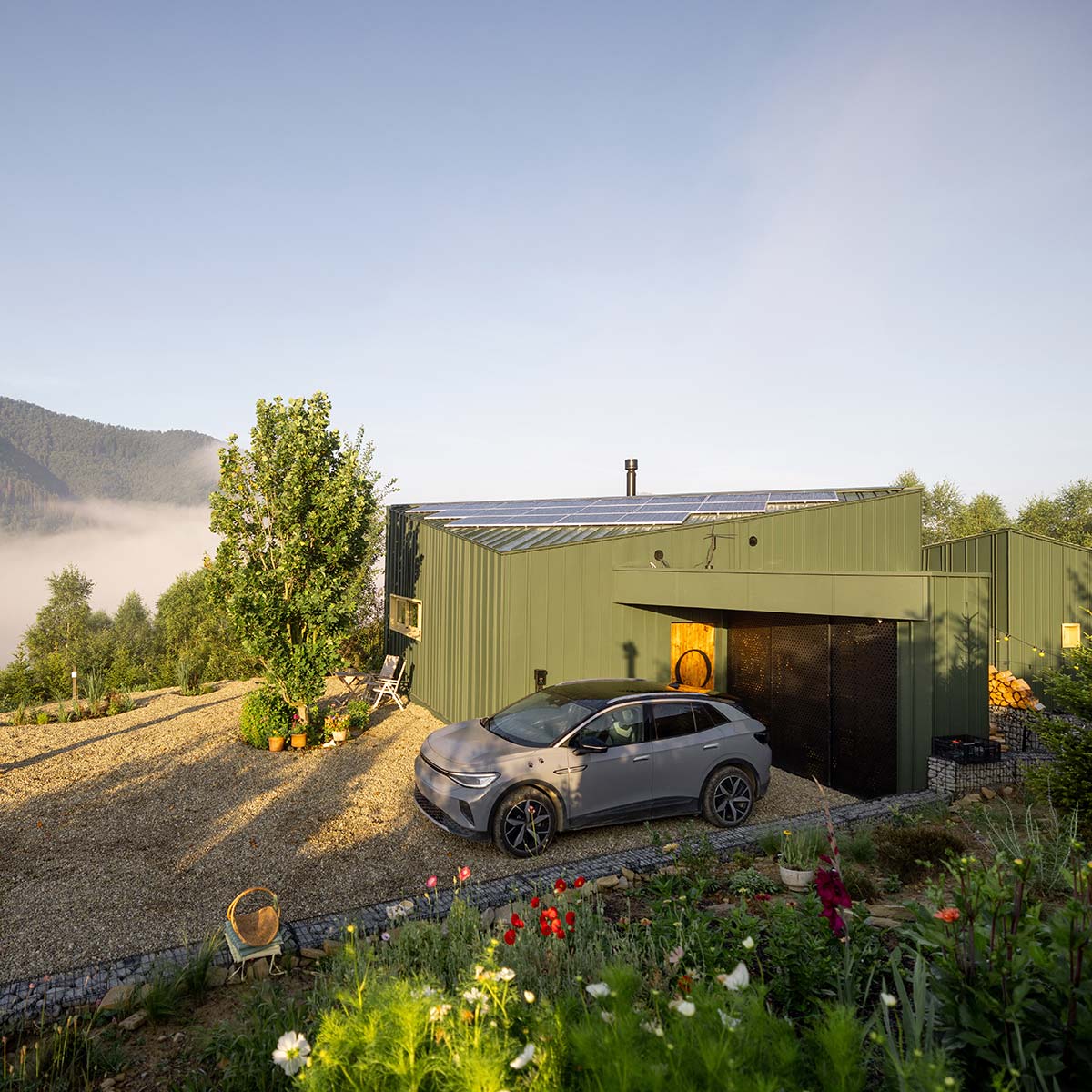 An off grid solar system powers this eco-friendly, fire resistant home in the remote mountains.