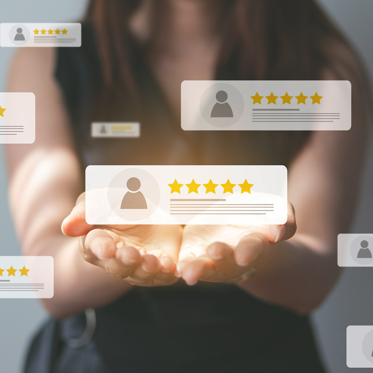 Image of woman with open hands with warm gold tone and review boxes hovering over hands.